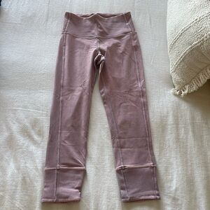 Size 4 Lululemon workout pants worn one time. Perfect condition and so cute!